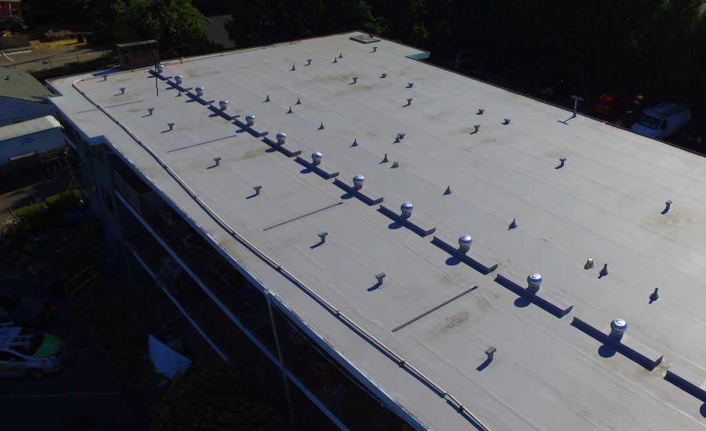 Burien Roofer Project: Ambaum Apartments, a TPO Roof with custom edge flashings