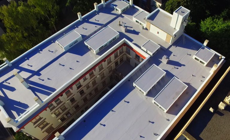 Residential & Commercial Roofing: Historic Chelsea Apartments With Modern TPO Roofing Top View from Distance