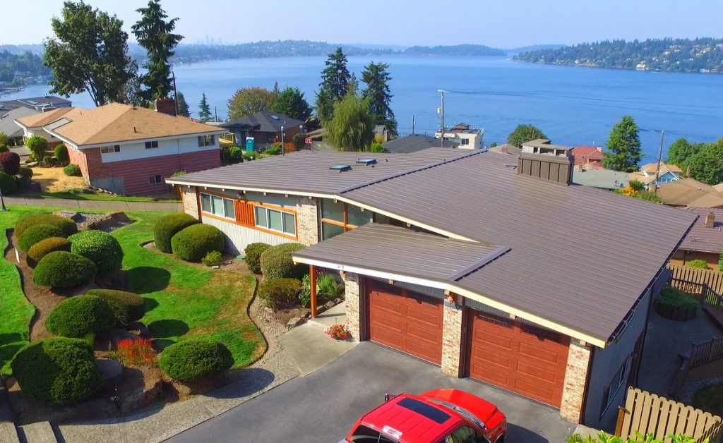 Photo of Lake Washington Metal Roof with high temp ice and water shield, new insulation, new fascia board, plywood, and the new metal roof and gutters