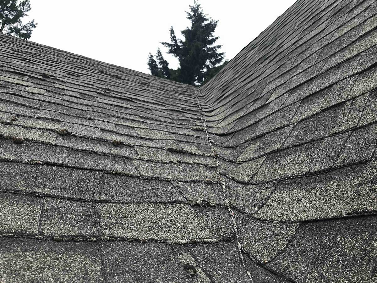 Home with roof with poor workmanship