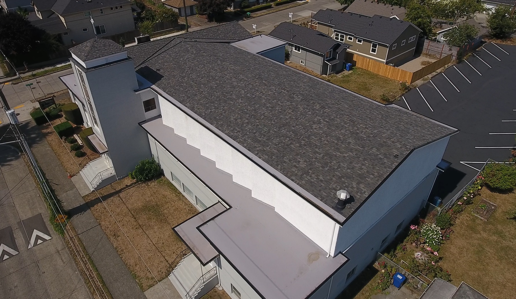 Photo of Seattle Church Roof commercial roofing project that required a combination of composition low-slope shingles, and TPO membrane