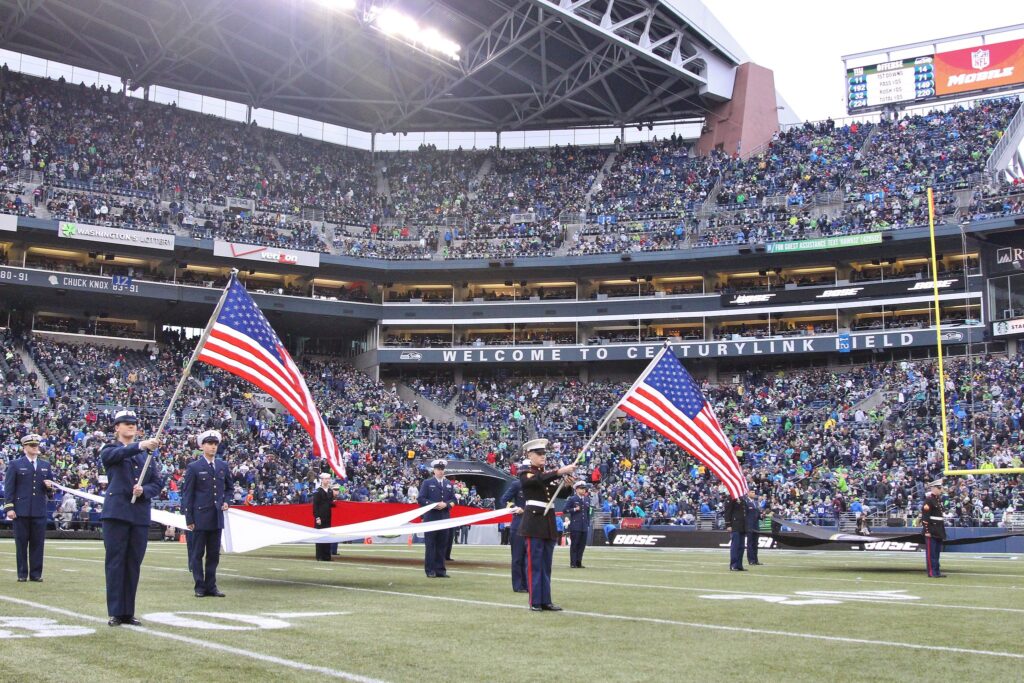 JSSWA Washington National Guard present and display American flags at the 2014 Seattle Seahawks Salute to Service Game. 