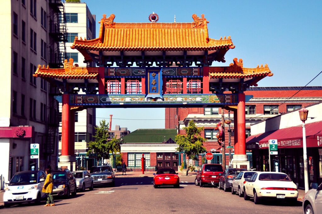 Chinatown street scene with beautiful red over-the-street gate in Seattle Washington.