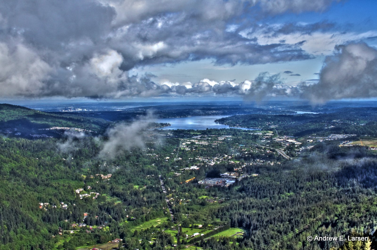 An aerial view of Issaquah that includes the highlands of Issaquah, Poo Poo Point, Tiger Mountain and Lake Sammamish.