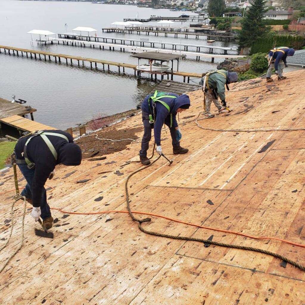 Three Tree Roofing Composite Roofing Team hard at work performing a roof deck inspection
