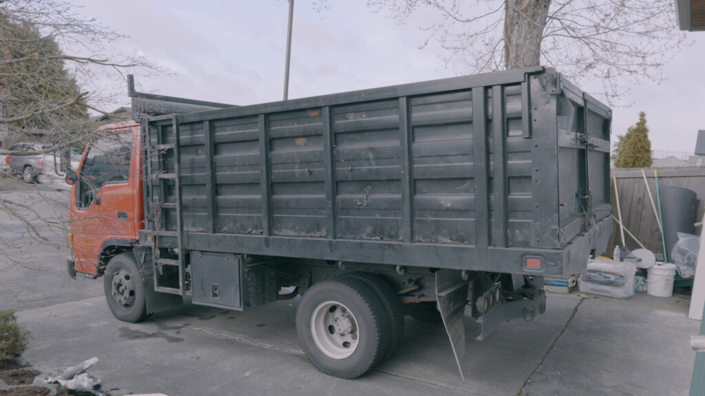 Three Tree Roofing places dumpsters to make sure homeowner clients can get in and out of their garage