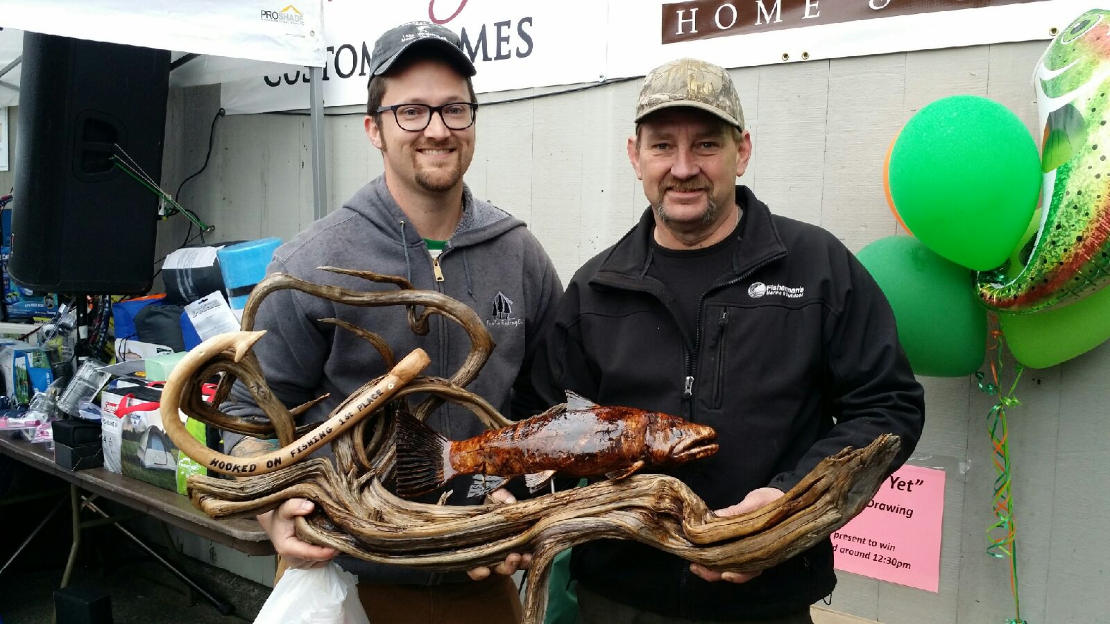 CJ of Three Tree Roofing with the award for winning The Annual Fishing Derby held at Lake Wilderness in Maple Valley, WA.