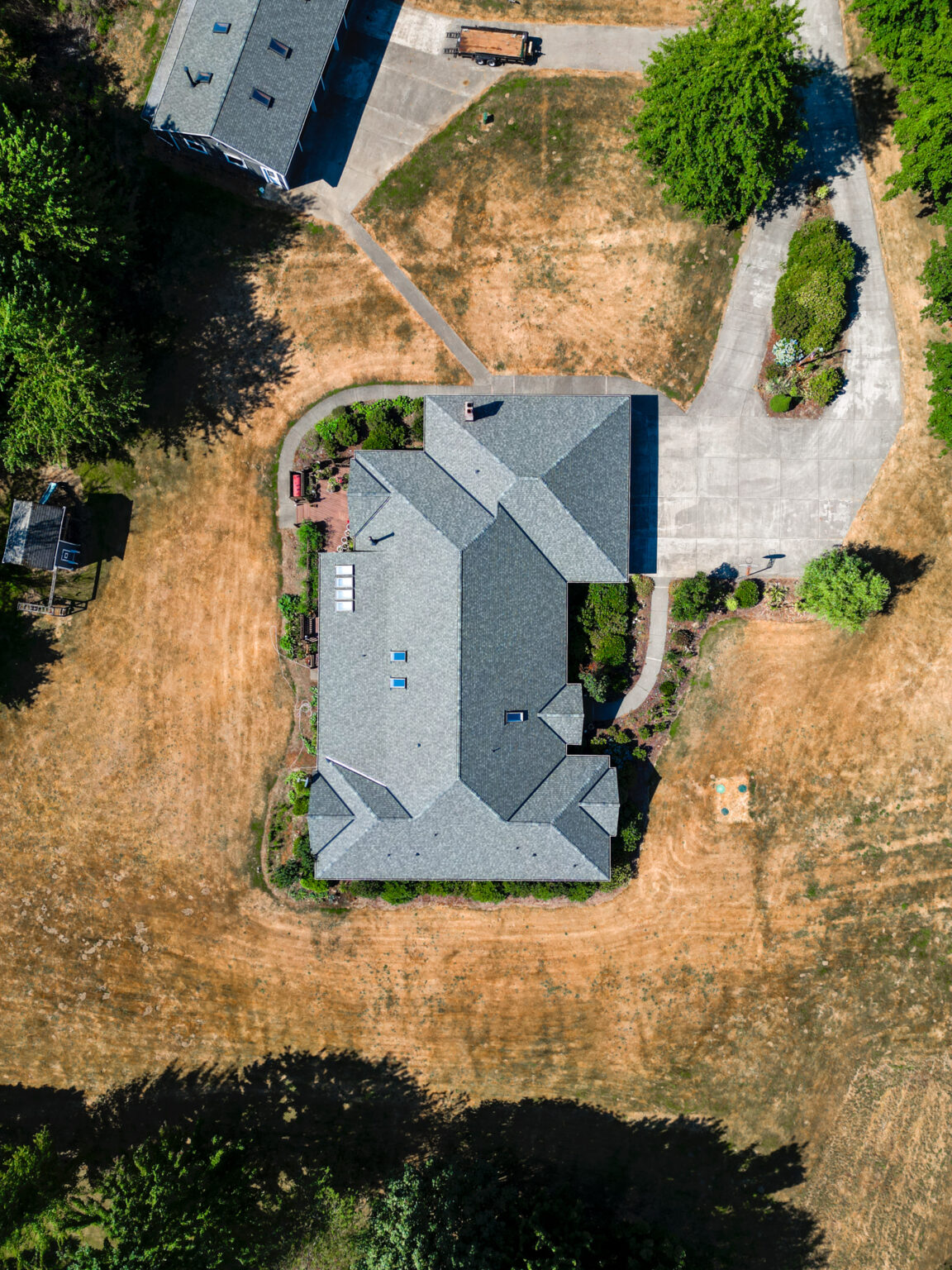 Home and Shop New Composite Shingles Roof in Kent, Washington - Zoomed out view of new home roof