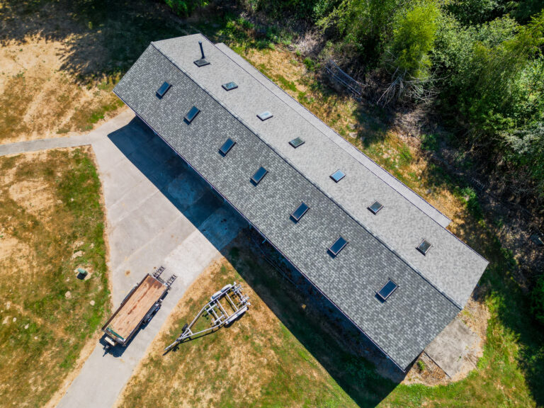 Home and Shop New Composite Shingles Roof in Kent, Washington - Close up view of skylights on new roof