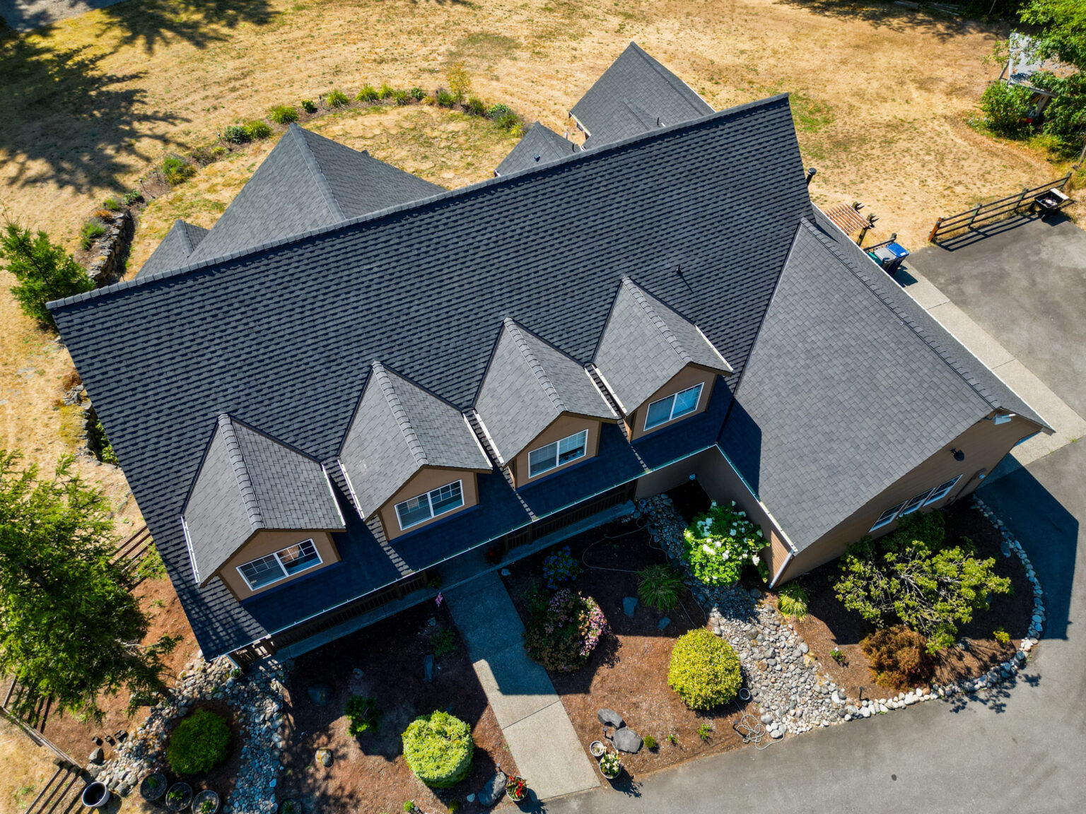 Multi-structure Residential Composite Shingles Roof in Ravensdale, Washington - Close up of home