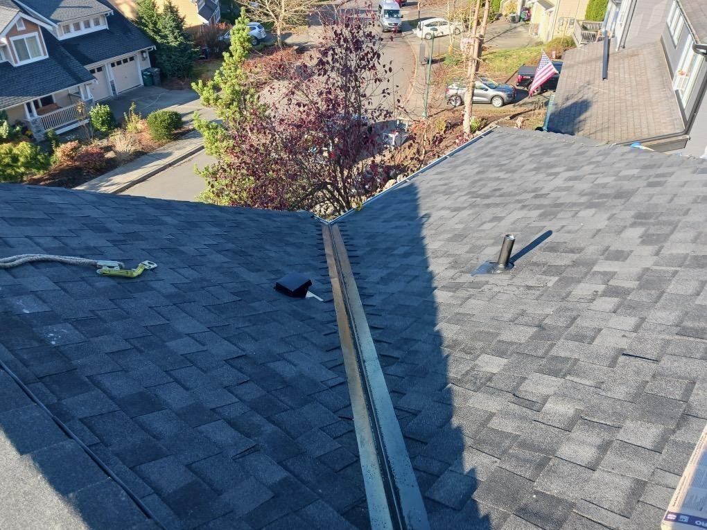 Finished Roof Valley installation on a new asphalt shingle roof