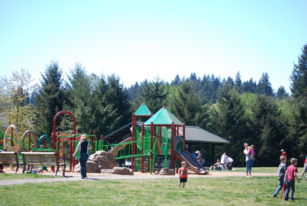 North Creek Park playground with covered play areas and climbing structures, Mill Creek, WA