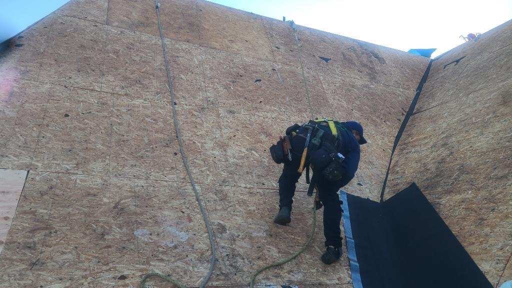 Roofers Install New Plywood for Roof Replacement