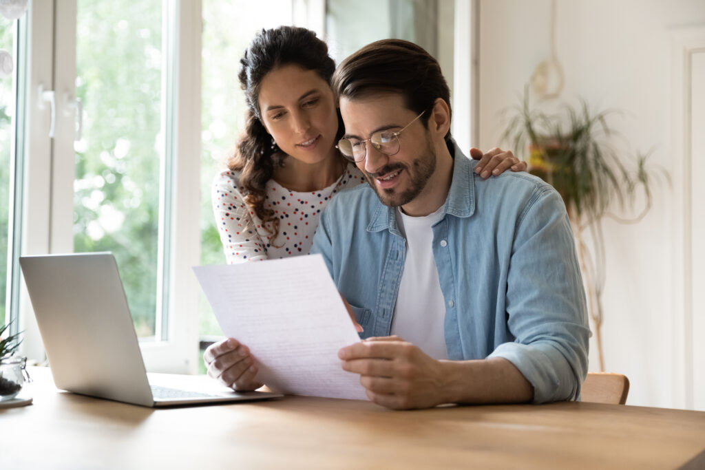 Couple reading energy credits from their solar system.