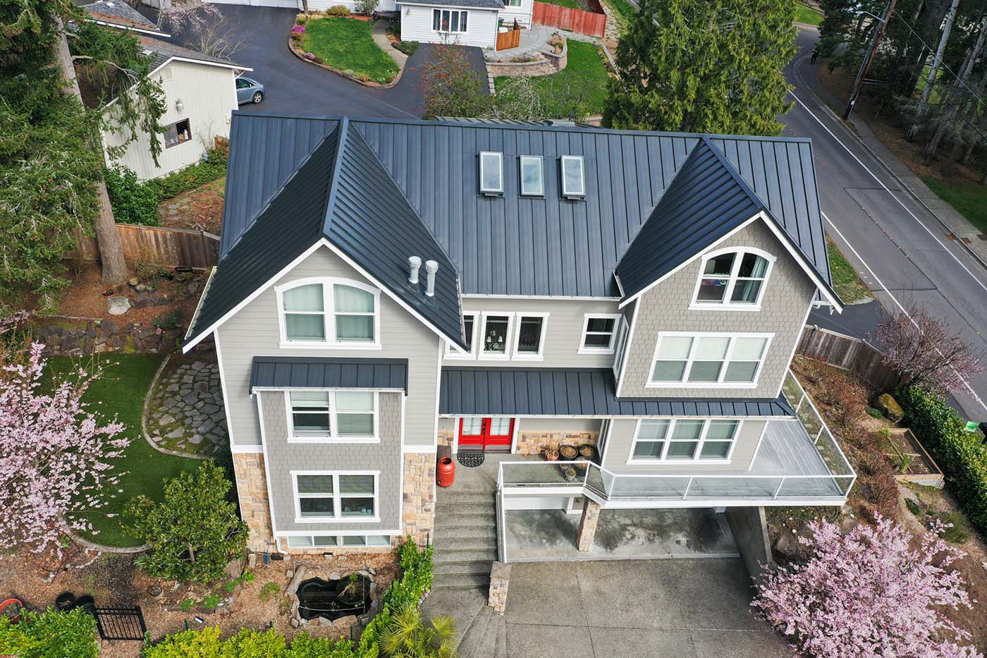 Before and After of New Metal Roof in Bellevue, Washington - view of front of house and roof