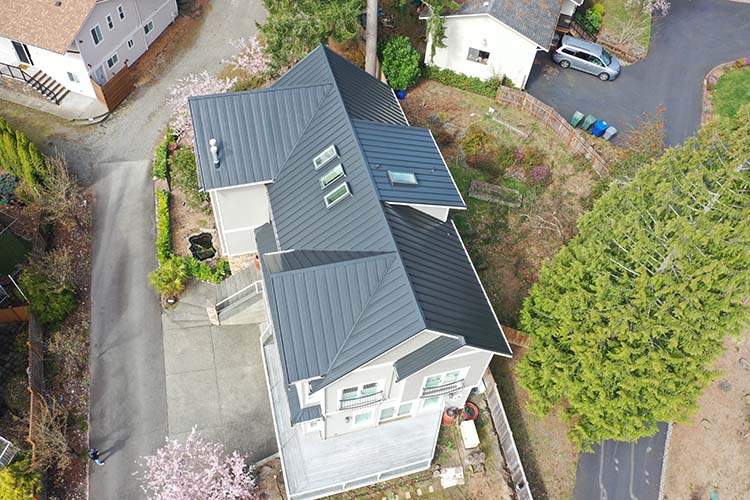Before and After of New Metal Roof in Bellevue, Washington - overhead view of roof from an angle
