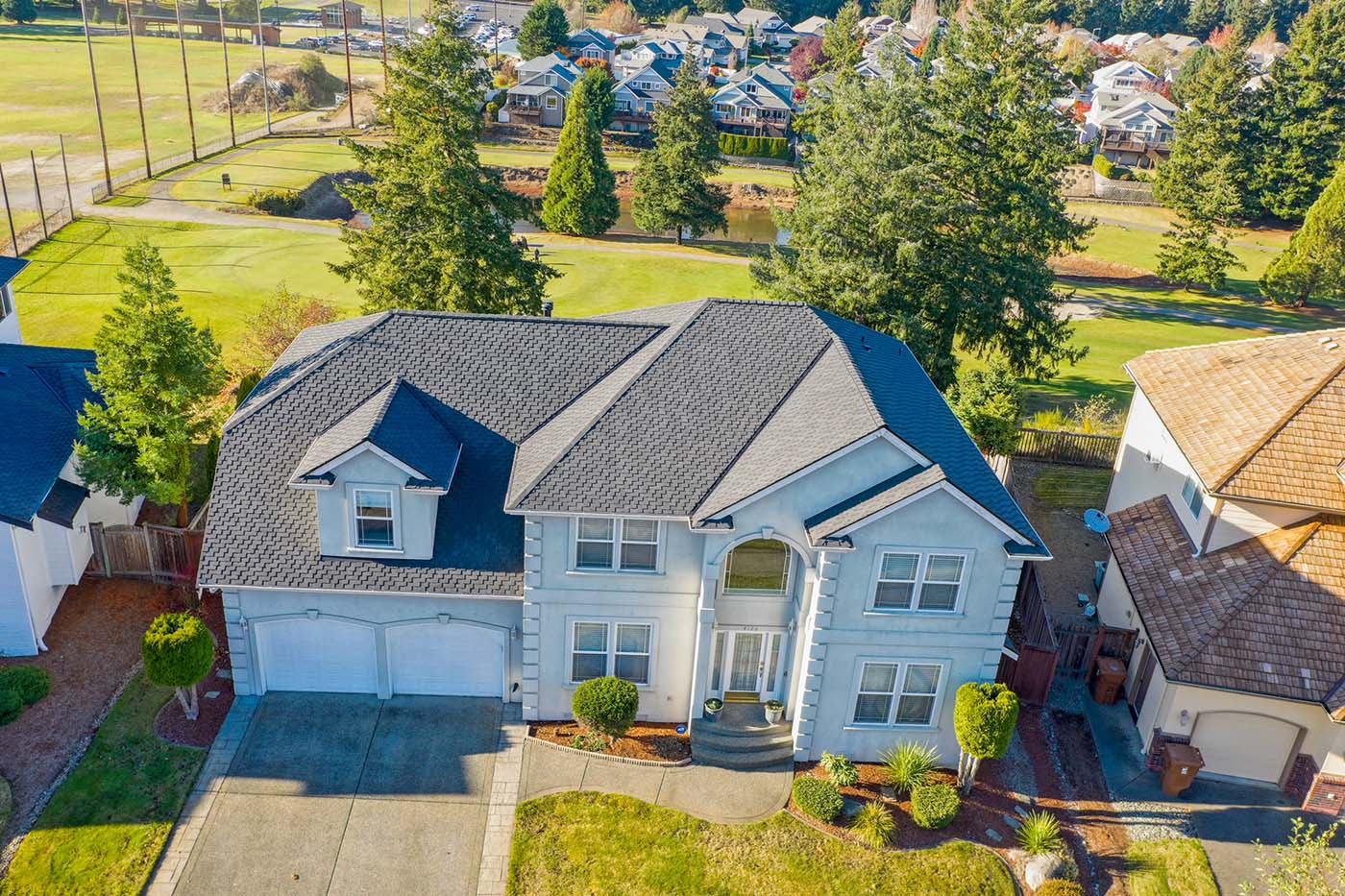 New Composite Asphalt Shingle Roof with Stucco in Tacoma, Washington - view of front of house