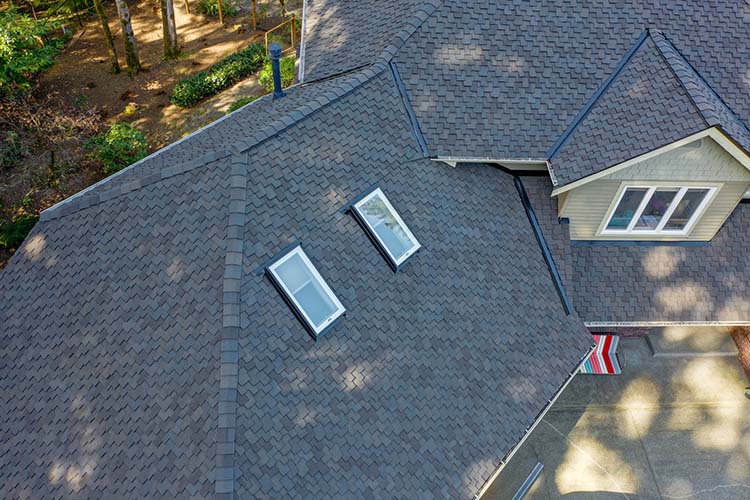 New Composite Asphalt Shingle Roof in Woodinville, Washington - close up top view of skylights