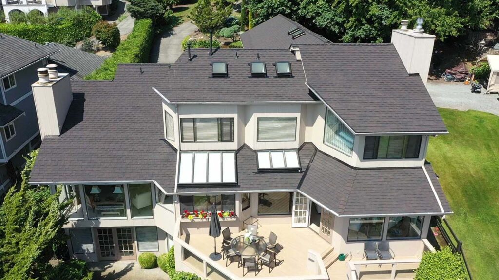 New Composite Asphalt Shingles Roof in Mercer Island, Washington: close up view of back of house.
