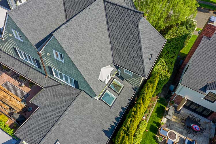 New Composite Asphalt Shingles Roof in Tacoma, Washington: close up view of roof skylights and other details