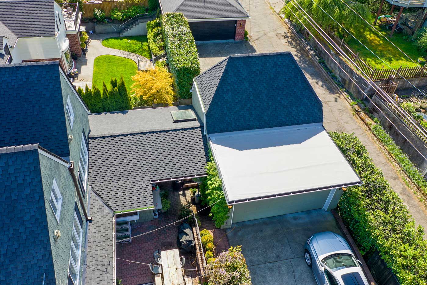 New Composite Asphalt Shingles Roof in Tacoma, Washington: close up view of garage roof