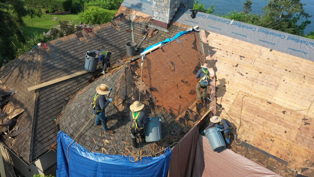 Three Tree Roofing Expert Roofing Crew hard at work on a house in Seattle, Washington.