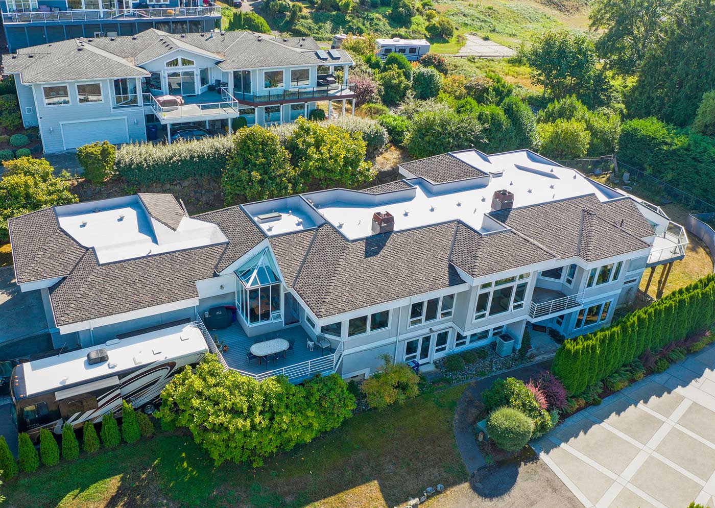 Three Tree Roofing portfolio project, combo composite shingle and flat TPO roof in Federal Way, Washington - top view from angle