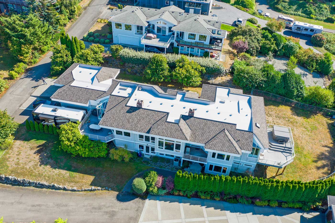 Three Tree Roofing portfolio project, combo composite shingle and flat TPO roof in Federal Way, Washington - top view from angle