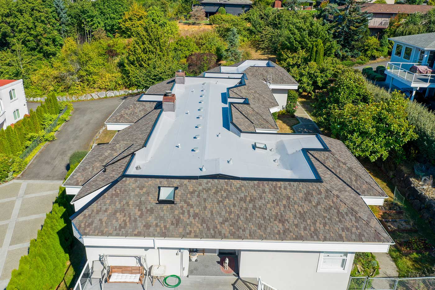 Three Tree Roofing portfolio project, combo composite shingle and flat TPO roof in Federal Way, Washington - view of flat roof from angle