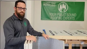 Three Tree Roofing Roofer discussing a half inch piece of styrofoam called fanfold designed to act as a barrier between the plywood and the membrane material.