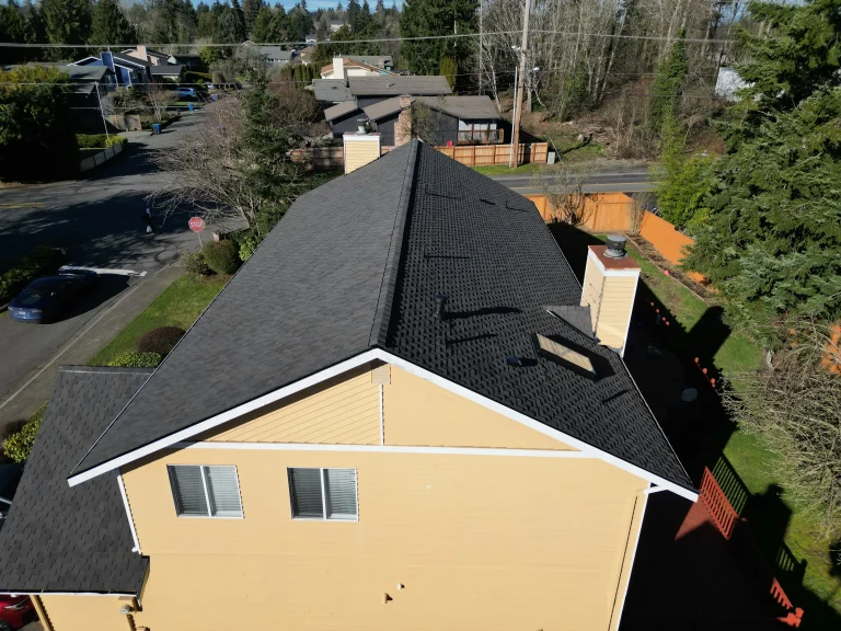 Aerial view from the side of the house of the new CertainTeed composite asphalt shingle roof in Auburn, Washington.