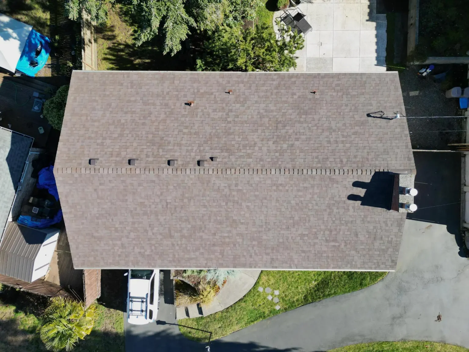 Overhead view from the front of the home of the lower pitch composite asphalt shingle roof in Des Moines, Washington.