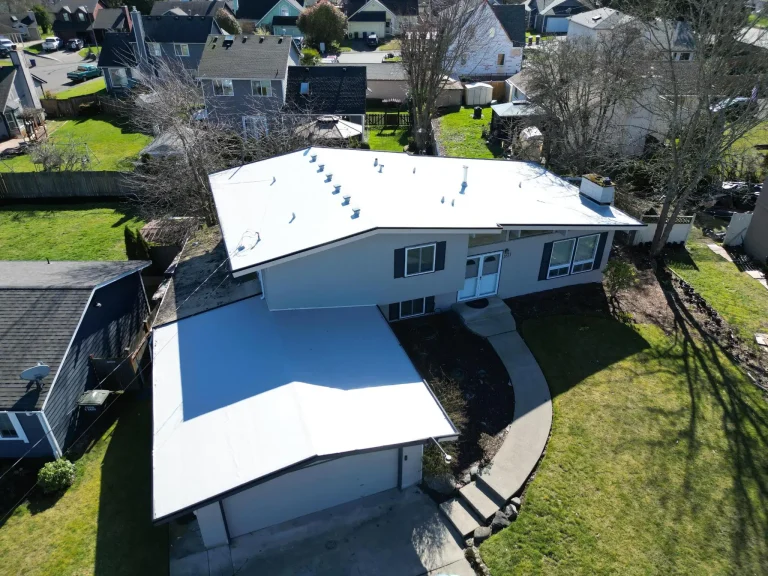 Angled aerial view from the front of a home featuring the PVC flat roof in Des Moines, Washington.