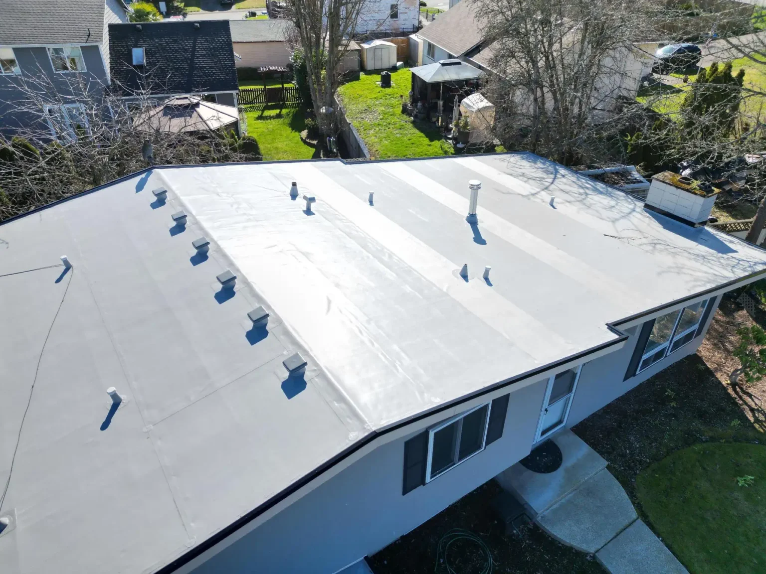 Overhead view from the front of the home with a new PVC flat roof in Des Moines, Washington.