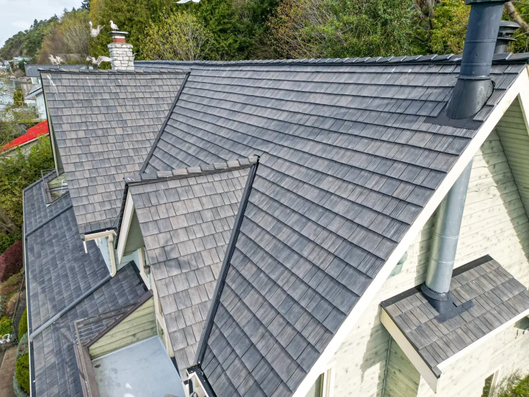 Close up view of ridge vents on house with a new Synthetic Cedar Shake Roof in Burien, Washington
