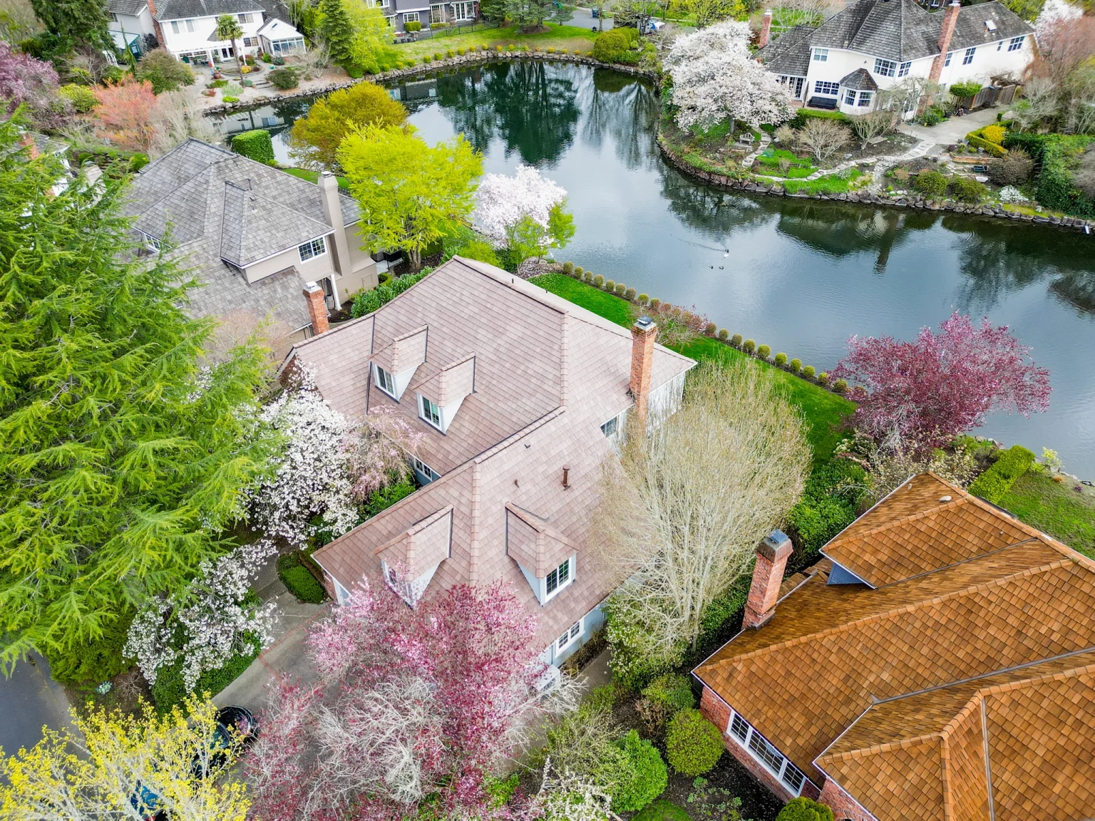 Zoomed out view of front of house with a new Synthetic Cedar Shake Roof in Mercer Island, Washington