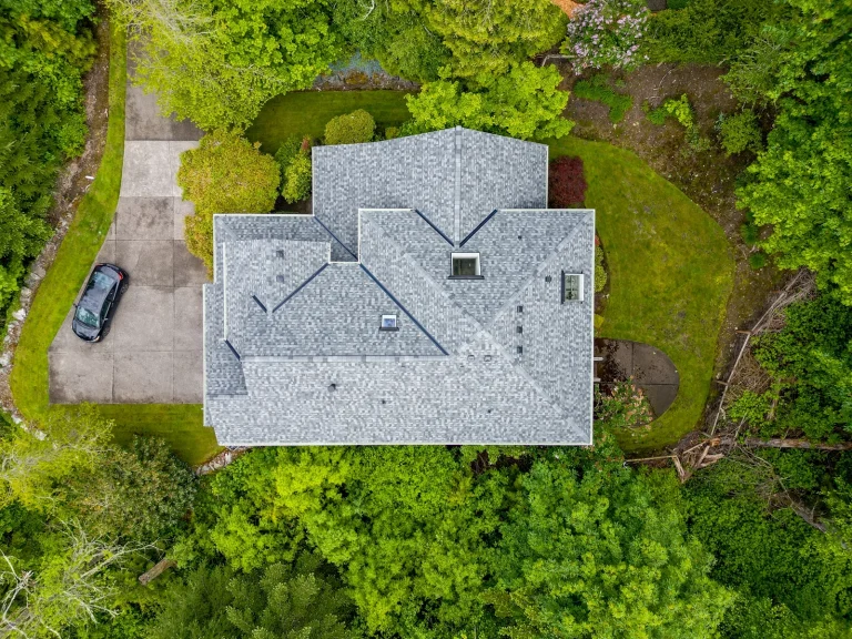 Zoomed out overhead view from the top of a house with a new Composite Asphalt Shingle New Roof Replacement in Bellevue, Washington