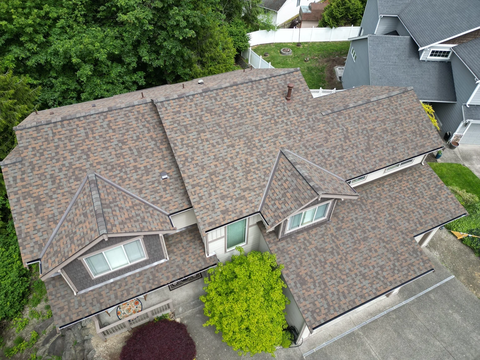 Close up overhead view of the front of a house with a New Roof Installation Composite Asphalt Shingle in Covington, Washington
