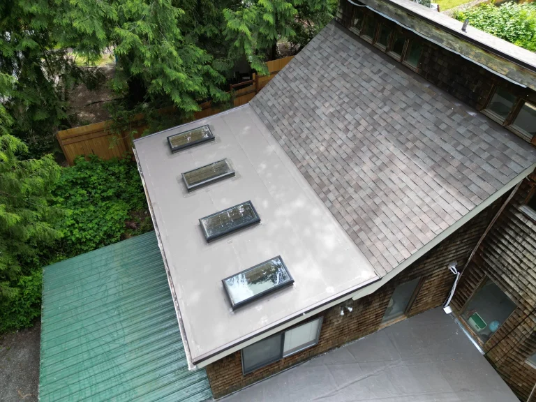 Close up view of new skylights of a new No Attic Composite Asphalt Shingle & Flat TPO Roof - Issaquah, Washington
