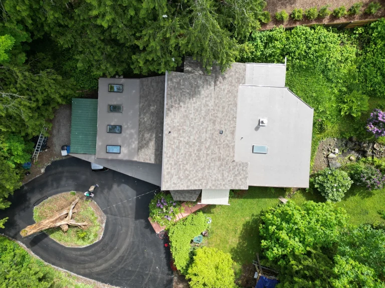 Overhead view of new roof on a house with a No Attic Composite Asphalt Shingle & Flat TPO Roof - Issaquah, Washington