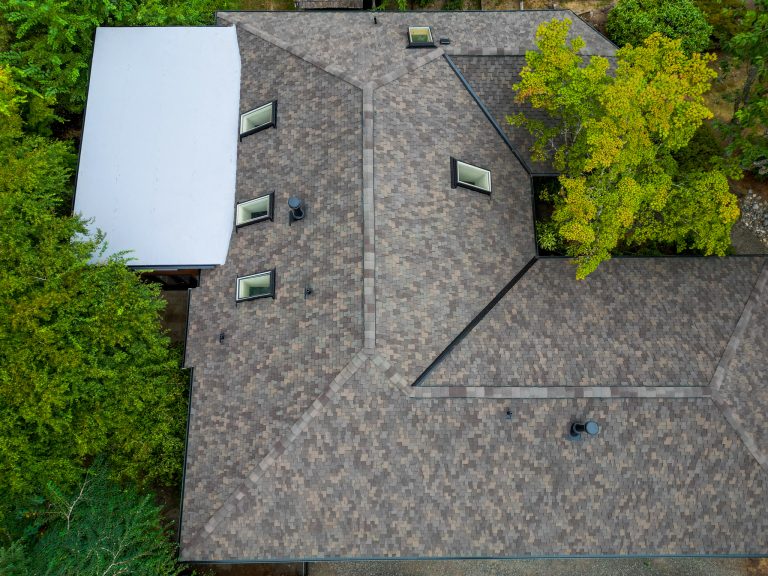 Composite Shingles Roof, Kirkland, Washington, close up of house with skylights and roof details including flat roof section