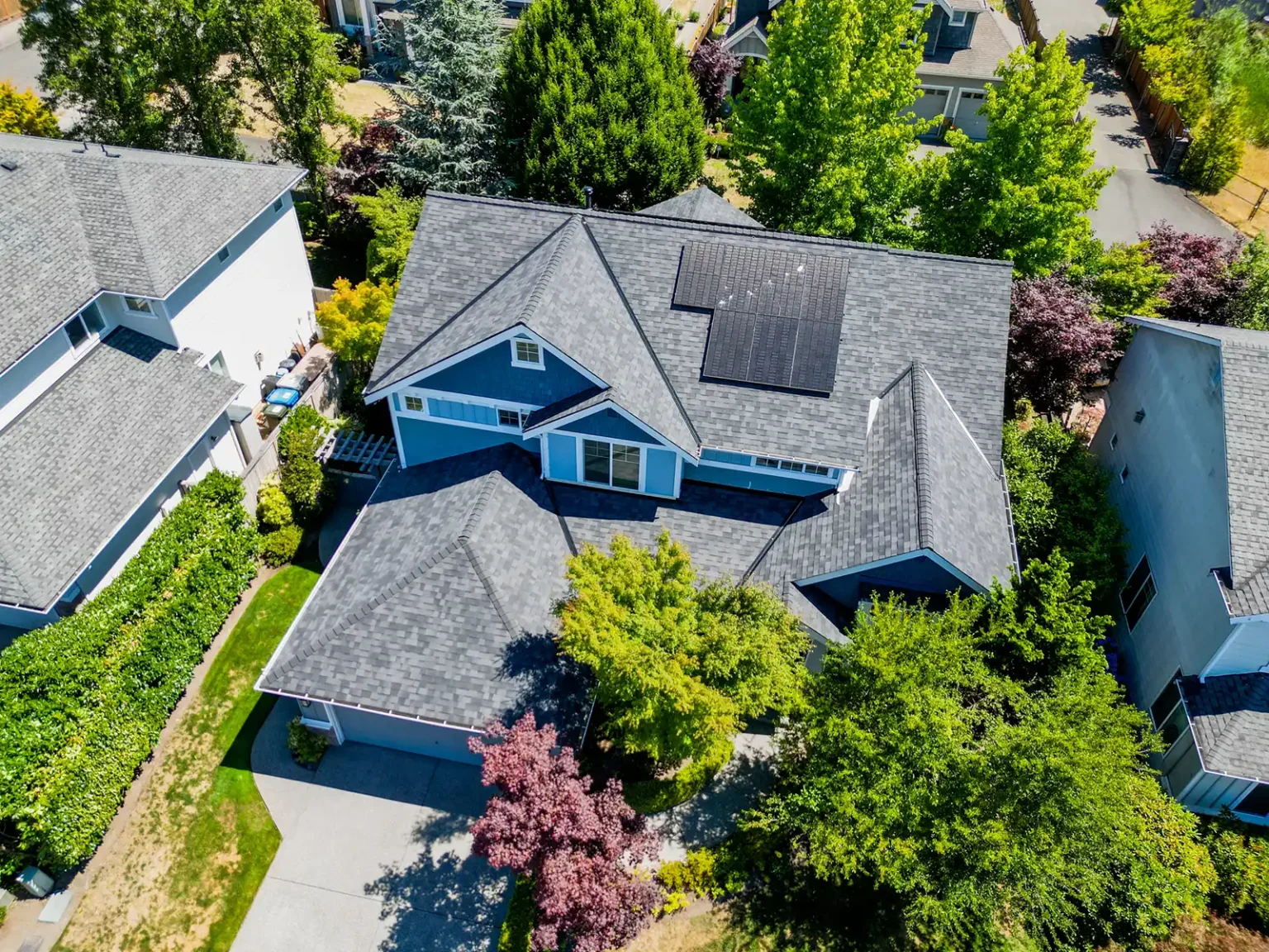 Overhead view of the front of a home with roof made of Composite Asphalt Shingles with Existing Solar in Renton, Washington