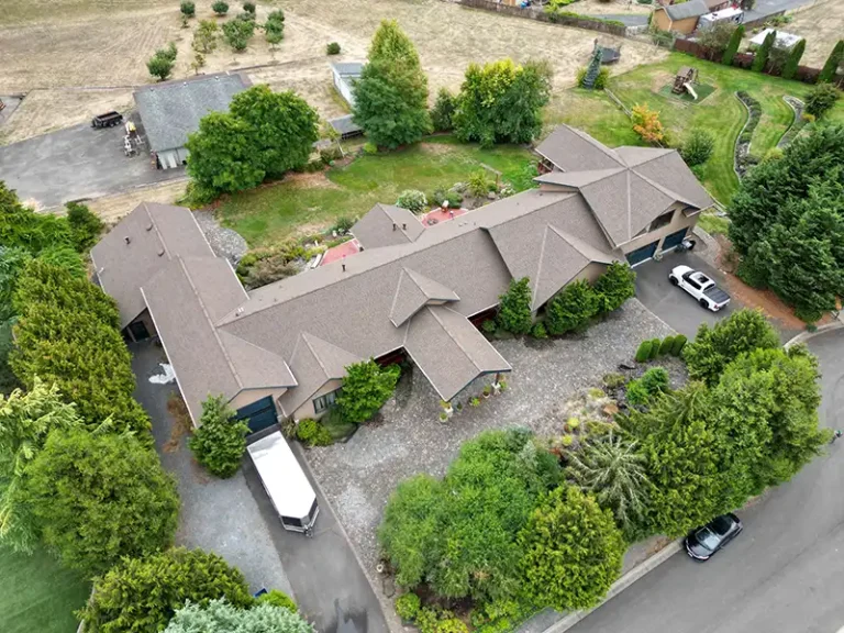 Overhead view from an angle of a large complex roof with valleys in Tacoma, Washington