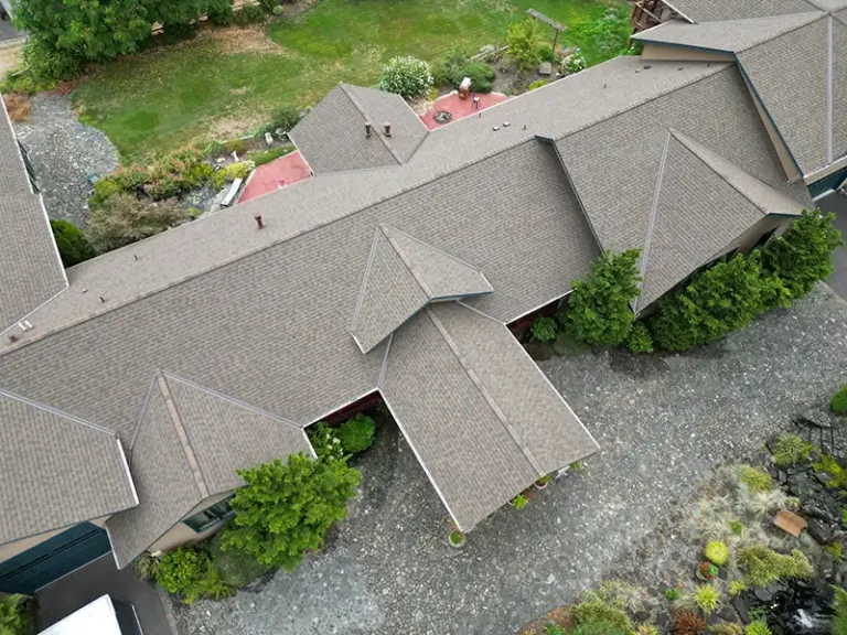 Close up overhead view from an angle of a large complex roof with valleys in Tacoma, Washington
