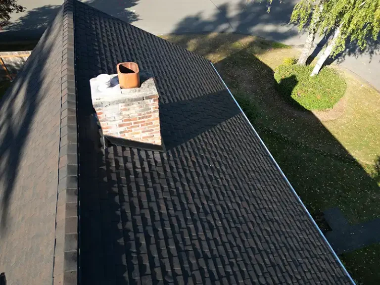 Close up view of a chimney on a New Composite Roof in Bellevue, Washington