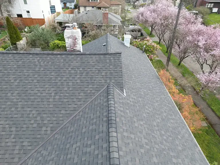 Close up view of top roof ridge caps of a home with a New Composite Shingle Roof in Seattle, Washington