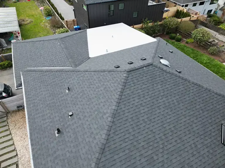 Close up view of top roof details of a home with a New Composite Shingle with Flat Roof in Seattle, Washington