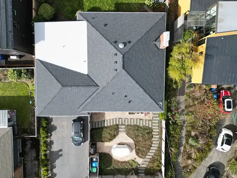 View of top of a home with a New Composite Shingle with Flat Roof in Seattle, Washington